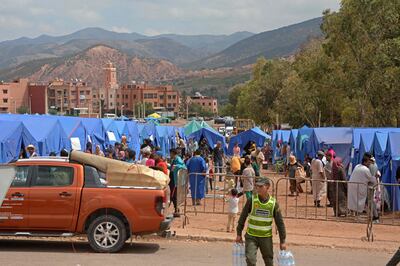 Displaced Moroccans gather at a shelter camp in the earthquake-hit village of Asni in al-Haouz province. AFP