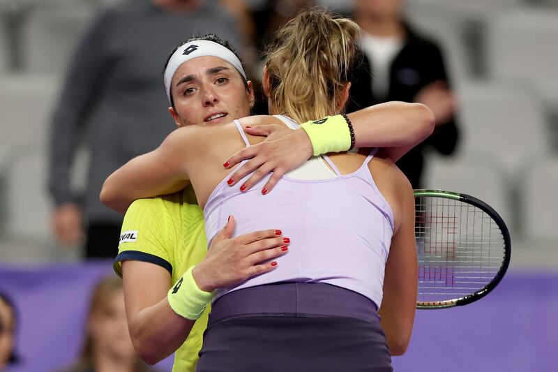 Ons Jabeur greets Aryna Sabalenka at the net after their match at the WTA Finals. Getty