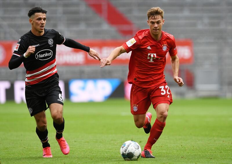 Fortuna Dusseldorf's Alfredo Morales in action with Bayern Munich's Joshua Kimmich. Reuters