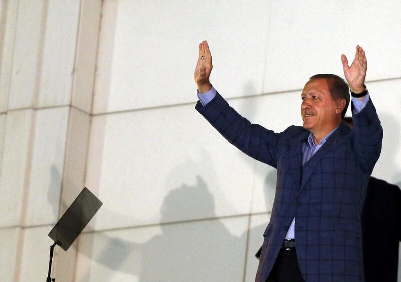 Recep Tayyip Erdogan waves at the crowd as he celebrates his election victory in Ankara. Umit Bektas / Reuters