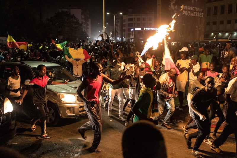 Supporters of the Senegal national football team celebrate in Dakar. AFP