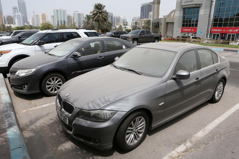 ABU DHABI , UNITED ARAB EMIRATES , JULY 24 – 2017 :- Dirty car parked in the parking area near the corniche in Abu Dhabi . ( Pawan Singh / The National ) Story by Haneen