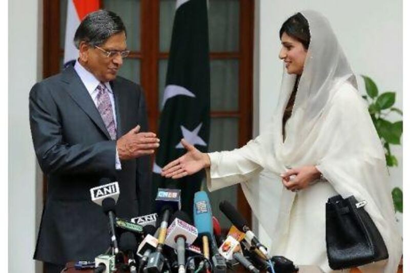 Pakistan's foreign minister, Hina Rabbani Khar, shakes hands with the Indian foreign minister, SM Krishna, before a meeting in New Delhi yesterday that was looking to breathe fresh life into a peace process still stifled by the trauma of the 2008 Mumbai attacks. Prakash Singh / AFP Photo