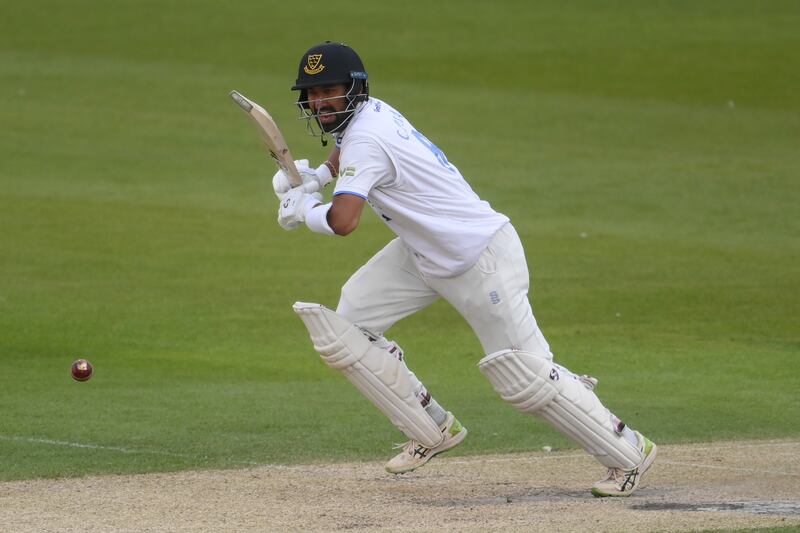 Cheteshwar Pujara of Sussex takes a quick single to reach his century against Durham. Getty