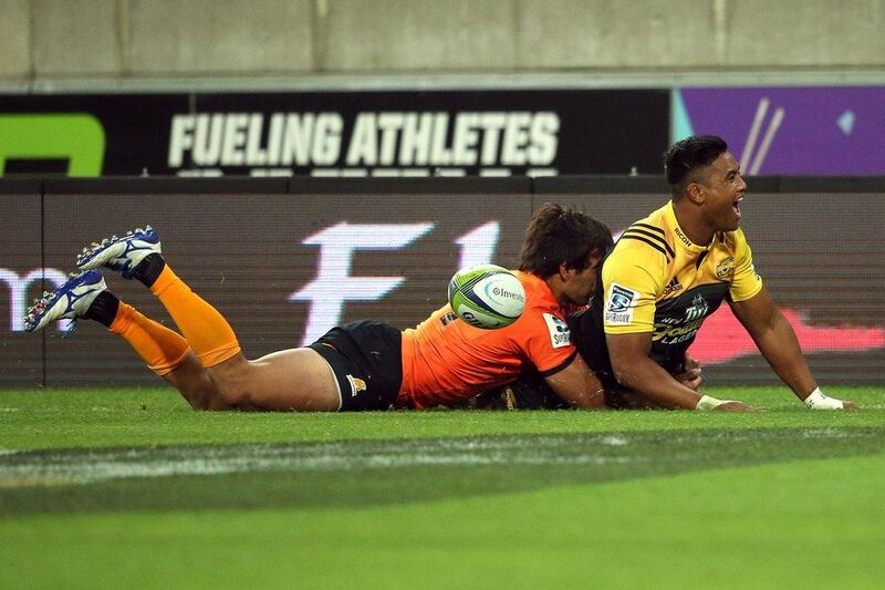 Julian Savea of the Wellington Hurricanes drives over to score a try against the Jaguares of Argentina in Super Rugby on Saturday. Martin Hunter / AFP / April 9, 2016 