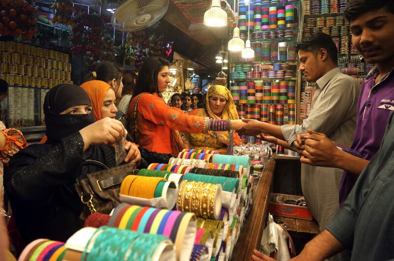 Women buy traditional bangles in preparation for the upcoming Eid Al Fitr celebrations, in Lahore, Pakistan. AP Photo