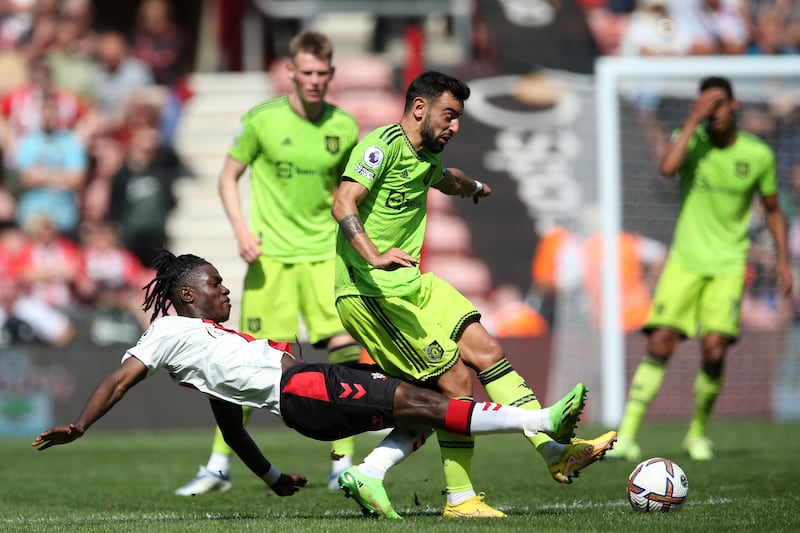 Romeo Lavia of Southampton battles for possession with Bruno Fernandes of Manchester United. Getty