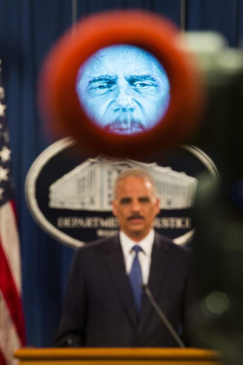 Attorney General Eric Holder is seen in a TV cameraman’s viewfinder as he announces a federal indictment against five Chinese military officials for cyber espionage at the Justice Department in Washington, DC, USA. Jim Scalzo / EPA