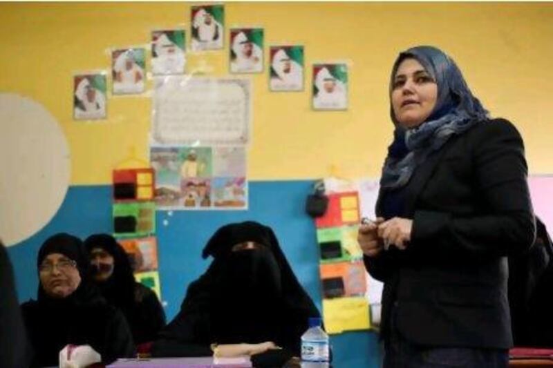 Maha Mohammad, a teacher at the Hind Bint Otaiba For Adult Education Center in RAK, conducts her evening class for women who want to obtain a secondary school certificate.