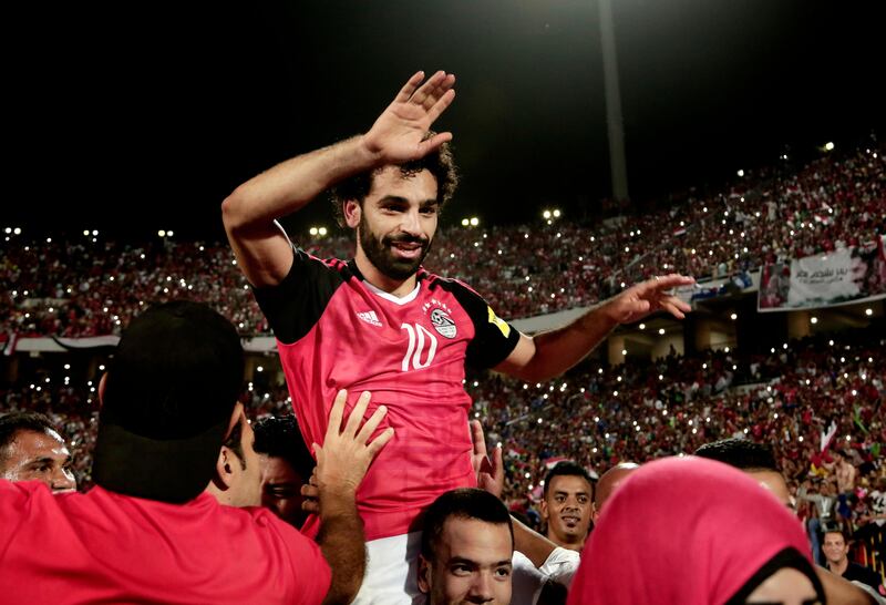 Egypt's Mohamed Salah celebrates defeating Congo during the 2018 World Cup group E qualifying soccer match at the Borg El Arab Stadium in Alexandria, Egypt, Sunday, Oct. 8, 2017. Egypt won 2-1. (AP Photo/Nariman El-Mofty)