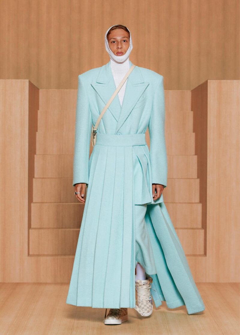 A baby blue suit is updated with an asymmetric panelled skirt for spring / summer 2022. Courtesy Louis Vuitton