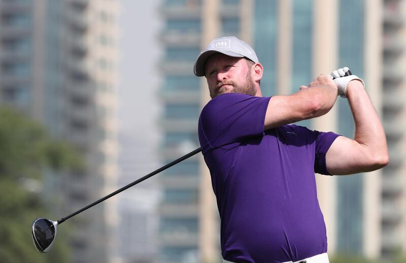 Jamie Donaldson of England plays a shot during the round two of the Dubai Desert Classic at Emirates Golf Club on January 26, 2018, in Dubai. / AFP PHOTO / KARIM SAHIB