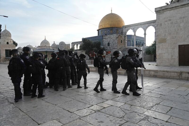 Israeli police in riot gear enter the Al Aqsa Mosque compound. Officers fired rubber bullets and stun grenades at Palestinian protesters. AP