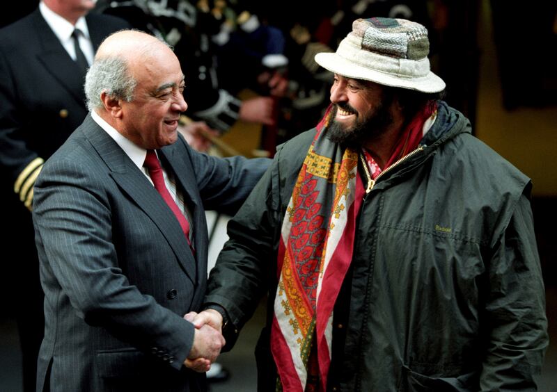 Italian tenor Luciano Pavarotti, right, greets Mohamed Al-Fayed. AP