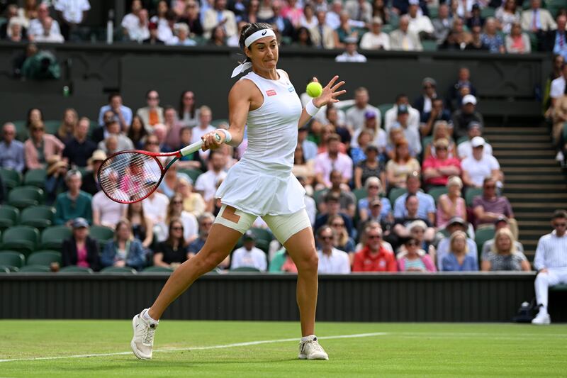 Caroline Garcia plays a forehand against Emma Raducanu. Getty