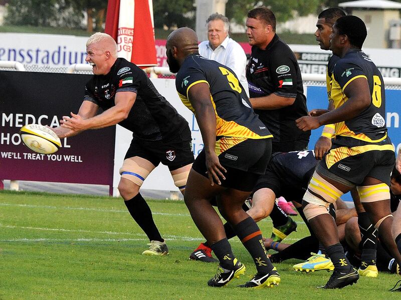 Dubai Hurricanes, in grey and yellow, were denied the chance of a final against Exiles in the UAE Premiership. Courtesy Dubai Exiles