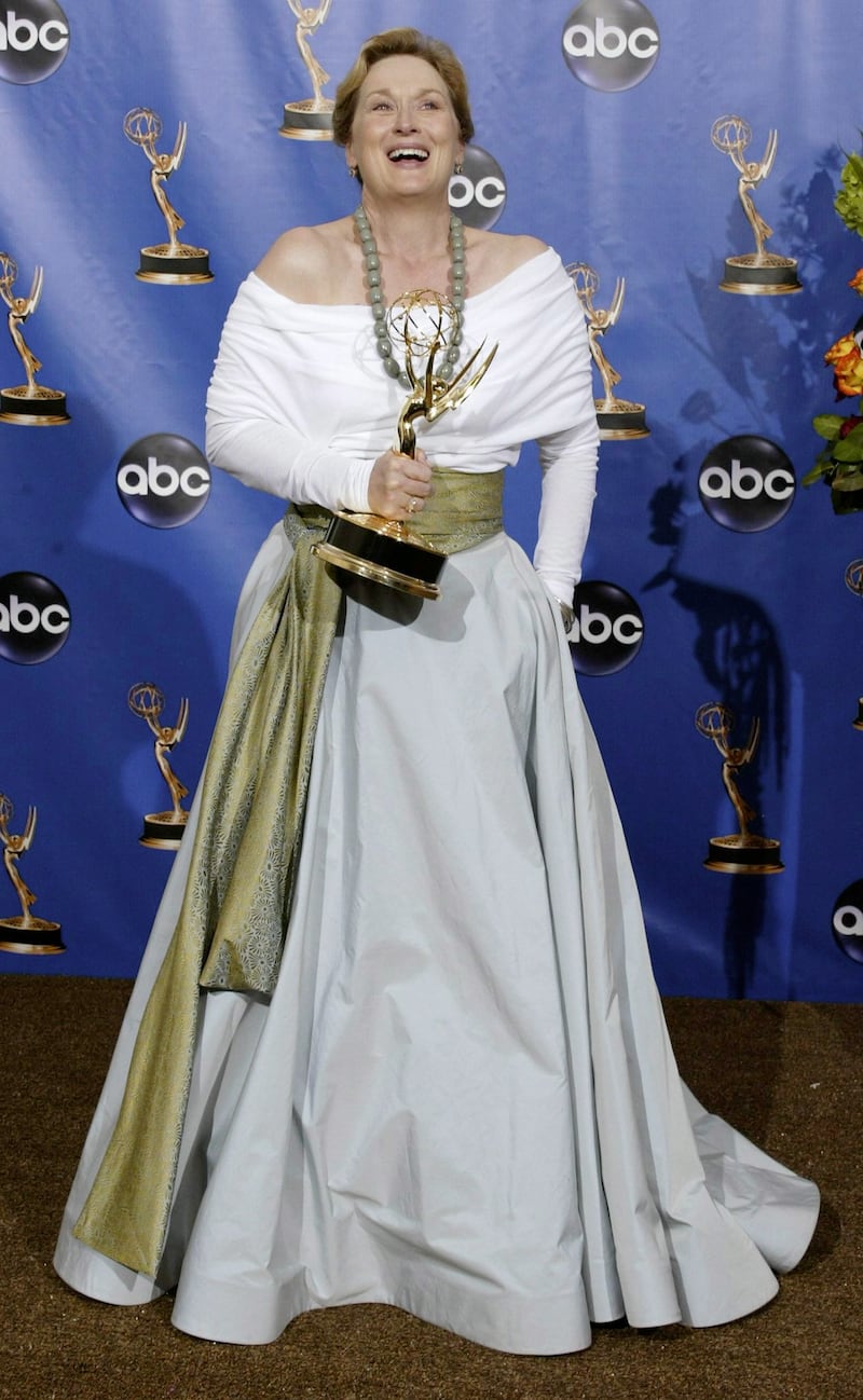 epa000278691 Actress Meryl Streep holds her emmy award for best lead actress in a miniseries or movie for her role in 'Angels in America' at the 56th Annual Primetime Emmy Awards, at the Shrine Auditorium in Los Angeles Sunday, 19 September 2004.  EPA/ARMANDO ARORIZO