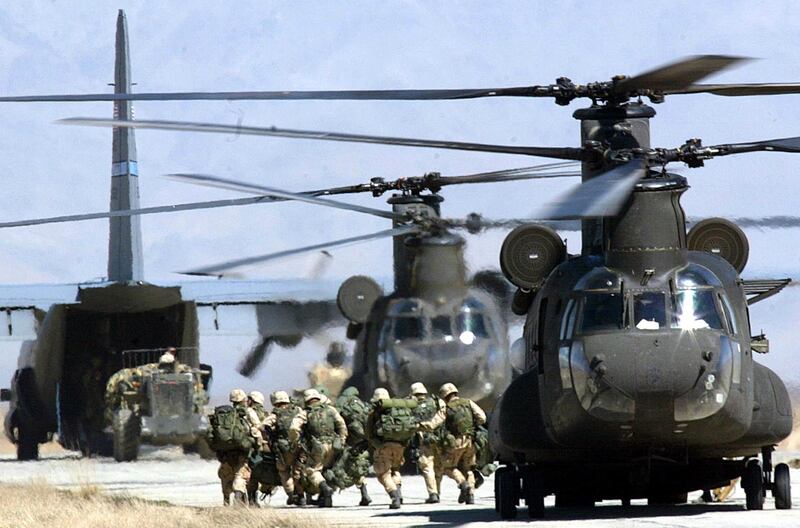 US soldiers disembark from a CH-46 Chinook helicopter at Bagram Air Base in 2002. AFP