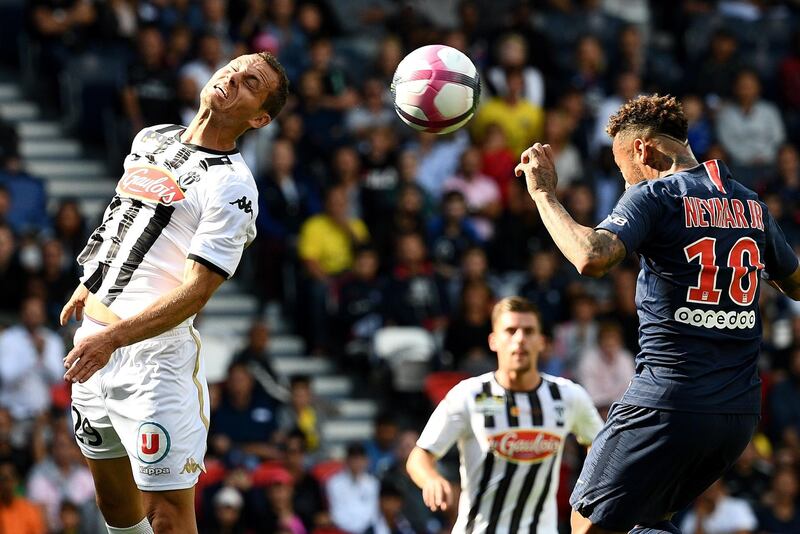 Angers' Vincent Manceau vies with Neymar. AFP