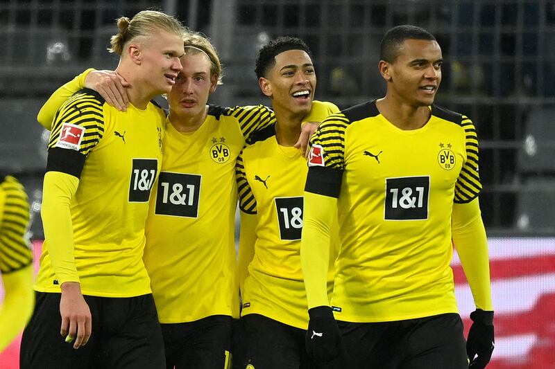 Dortmund's Erling Haaland celebrates with teammates after scoring in the Bundesliga match against Bayern Munich in December, 2021. AFP