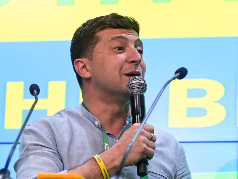 Ukrainian President Volodymyr Zelensky gives a speech at his Servant of the People party's election headquarters in Kiev on July 21, 2019, after Ukraine's parliamentary election. Ukrainians gave their comedian-turned-president Volodymyr Zelensky a mandate to reboot the country's politics on July 21, 2019 by handing his party a record score in parliamentary elections, exit polls showed. / AFP / Genya SAVILOV

