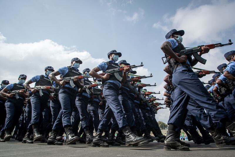 Police march during a parade to display new police uniforms and instruct them to maintain impartiality and respect the law during the general election, in Meskel Square in downtown Addis Ababa, Ethiopia.  AP Photo