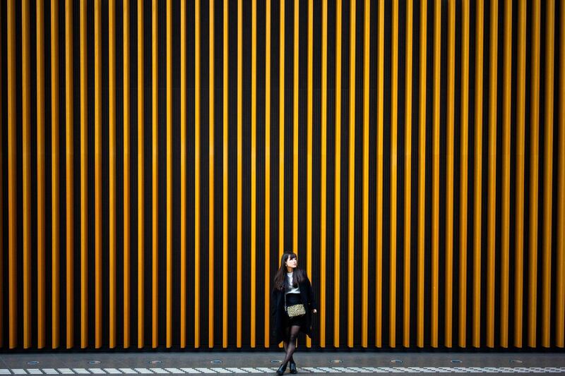 A woman waits at the Tokyo international forum in Japan. AFP