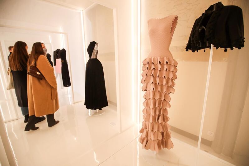 Creations designed by Tunisian fashion designer Azzedine Alaia, right, and Spanish fashion designer Cristobal Balenciaga, left, are displayed during the 'Alaia et Balenciaga - Sculpteurs de la forme' exhibition at Azzedine Alaia Foundation in Paris, France. EPA