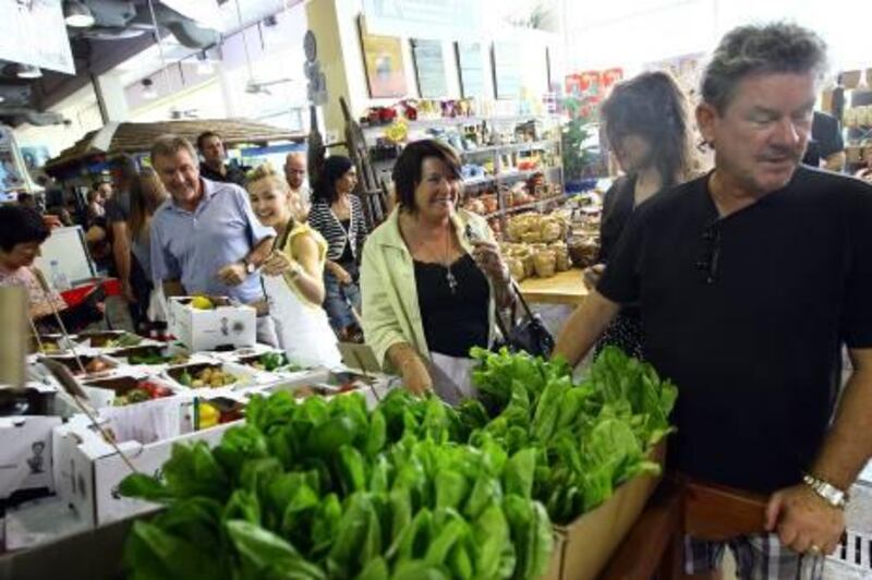 Dubai, United Arab Emirates- June 25,  2011:    Visitors  browse the  Organic Vegetable stalls at the  Bumble Box Market at Dubai Garden Centre  in Dubai .  ( Satish Kumar / The National )  For Arts &  Life