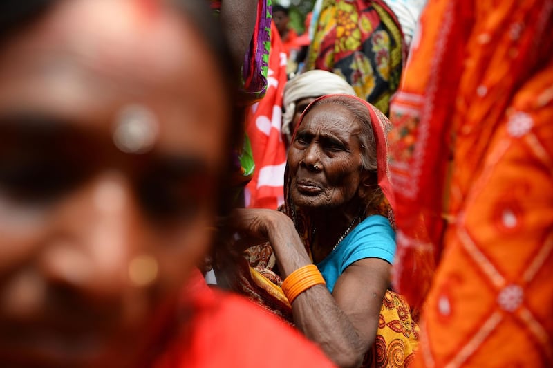 A woman looks on at a protest rally called by the Centre of Indian Trade Unions in New Delhi. Sajjad Hussain/AFP