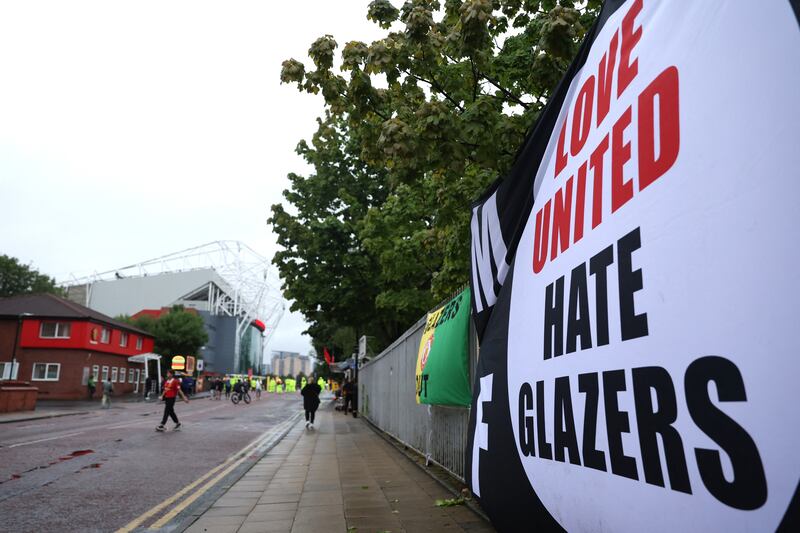 A banner is displayed protesting the Glazer family’s ownership. Action Images