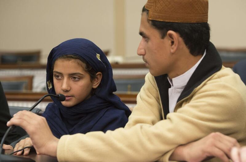 Nabila Rehman (left), 9, and her brother Zubair, 13, who were injured by a US drone strike in Pakistan, attend a press conference on Capitol Hill. Jim Watson / AFP



