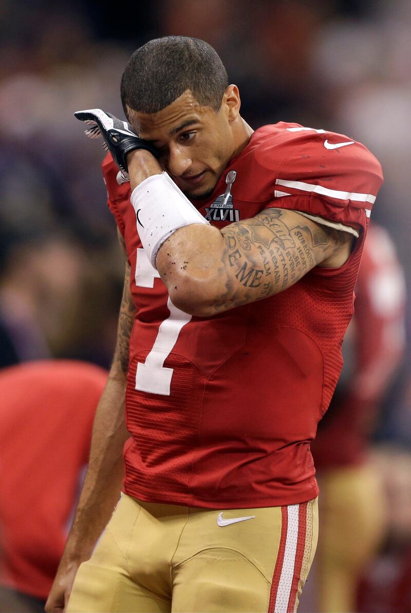 San Francisco 49ers quarterback Colin Kaepernick (7) wipes his face after losing 34-31 to the Baltimore Ravens in the NFL Super Bowl XLVII football game, Sunday, Feb. 3, 2013, in New Orleans. (AP Photo/David Goldman)  *** Local Caption ***  Super Bowl Football.JPEG-09801.jpg