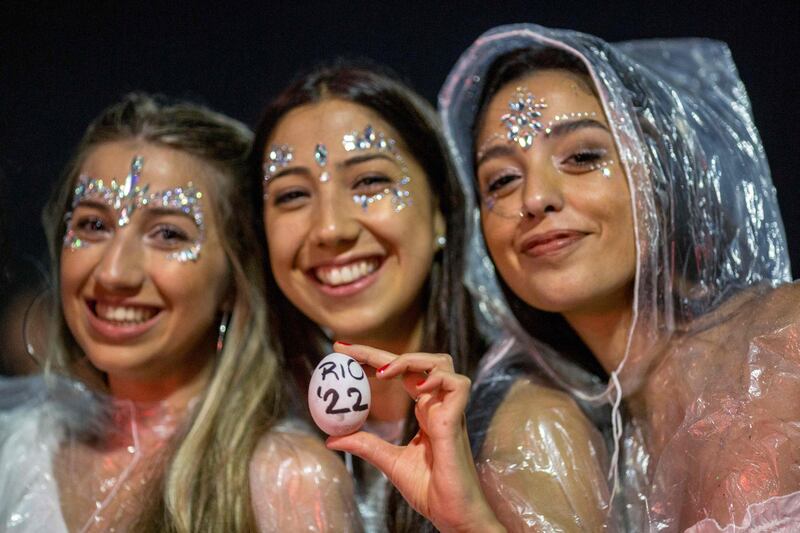 Women pose for photo on New Year's Eve at Copacabana beach in Rio de Janeiro, Brazil. AFP