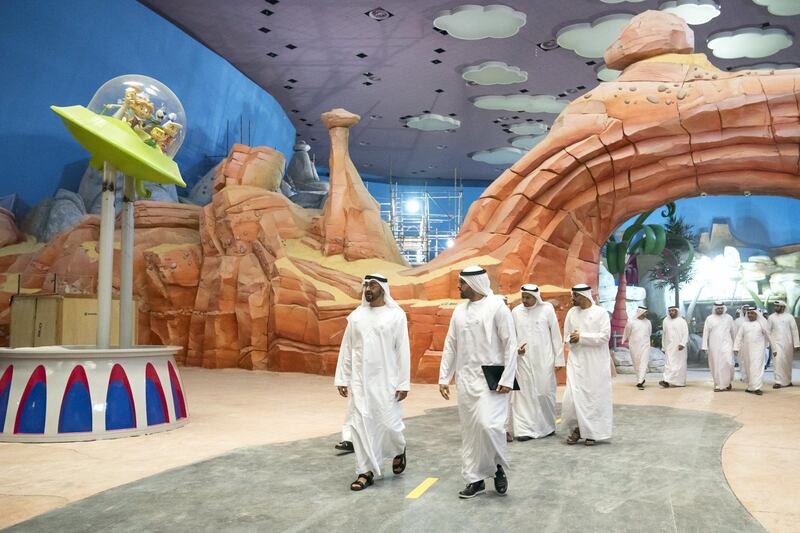 YAS ISLAND, ABU DHABI, UNITED ARAB EMIRATES -  March 1, 2018: HH Sheikh Mohamed bin Zayed Al Nahyan, Crown Prince of Abu Dhabi and Deputy Supreme Commander of the UAE Armed Forces (center L), inspects construction of Warner Bros World Abu Dhabi, with and HE Mohamed Khalifa Al Mubarak Chairman of the Department of Culture and Tourism and Abu Dhabi Executive Council Member (center R). 
( Ryan Carter for the Crown Prince Court - Abu Dhabi )
---