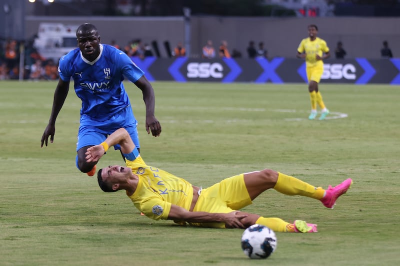 Al Nassr's Cristiano Ronaldo after being fouled by Al Hilal defender Kalidou Koulibaly.