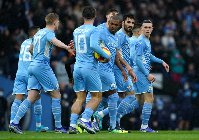 Manchester City's Ilkay Gundogan, second right, celebrates the first goal on Saturday. PA