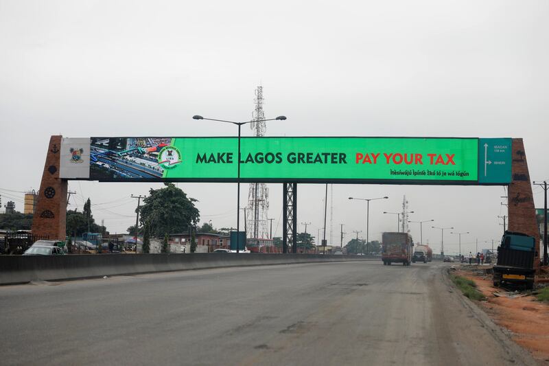 A sign advertising instructions on tax payment is seen on a billboard on the Lagos-Ibadan expressway in Lagos, Nigeria August 3, 2017.REUTERS/Akintunde Akinleye