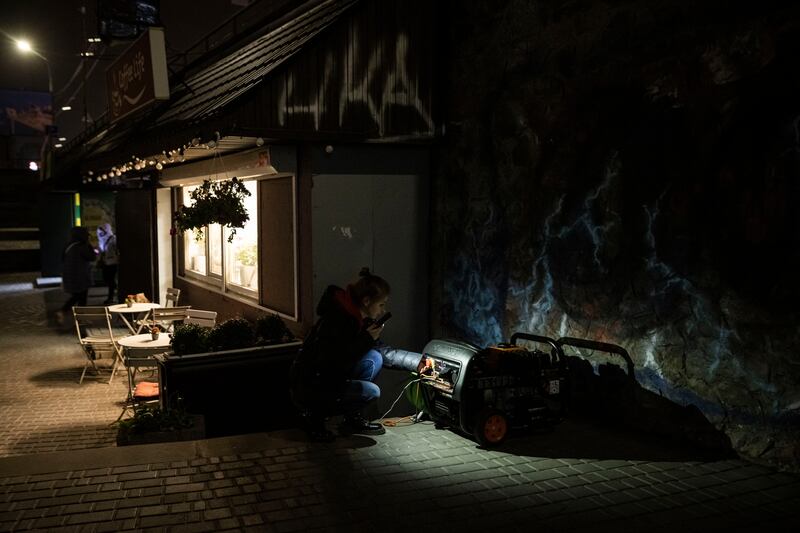 In Kyiv, an electrical generator is used to provide power to a cafe after electricity was cut on Saturday. Getty