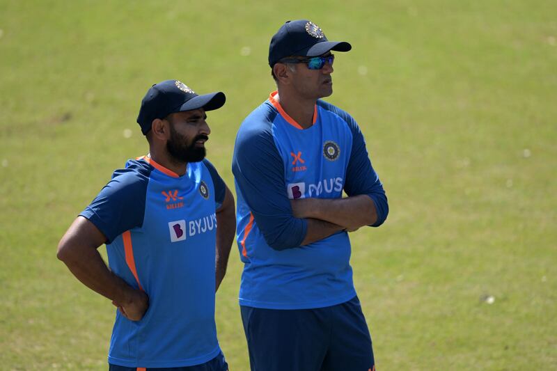 India's Mohammed Shami and coach Rahul Dravid during training. AFP