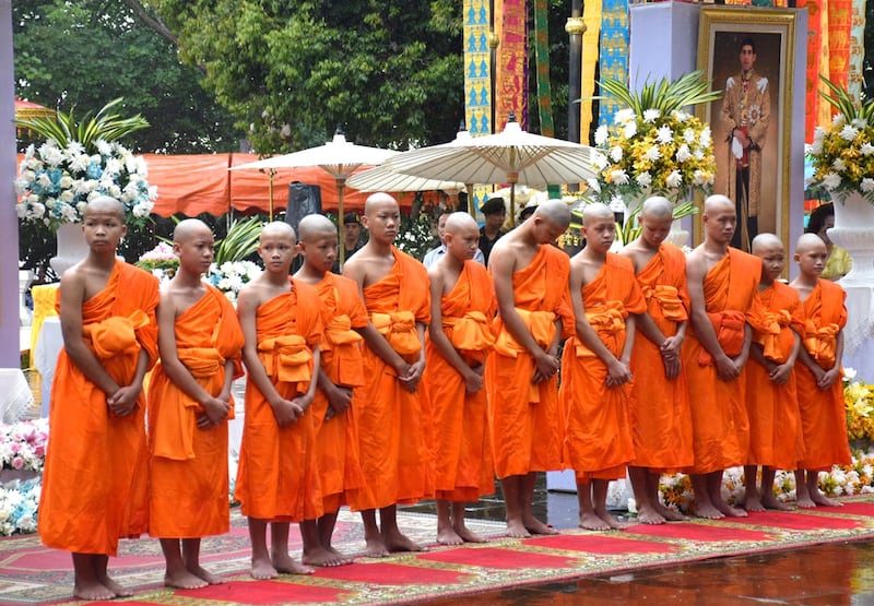 epa06908914 Members of the Wild Boars soccer team, who were rescued from Tham Luang cave, pose for photographs after their participation in a Buddhist novice monk ordination ceremony at Wat Phra That Doi Wao temple in Mae Sai district, Chiang Rai province, Thailand, 25 July 2018. The thirteen members of Wild Boar child soccer team, including their assistant coach, were safely rescued after being trapped in Tham Luang cave since 23 June 2018.  EPA/CHAICHAN CHAIMUN