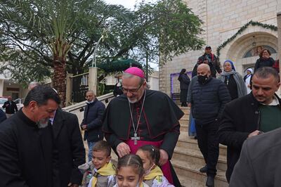 Latin Patriarch of Jerusalem Archbishop Pierbattista Pizzaballa is greeted on his arrival to Holy Family Church in Gaza City, December 17. AFP