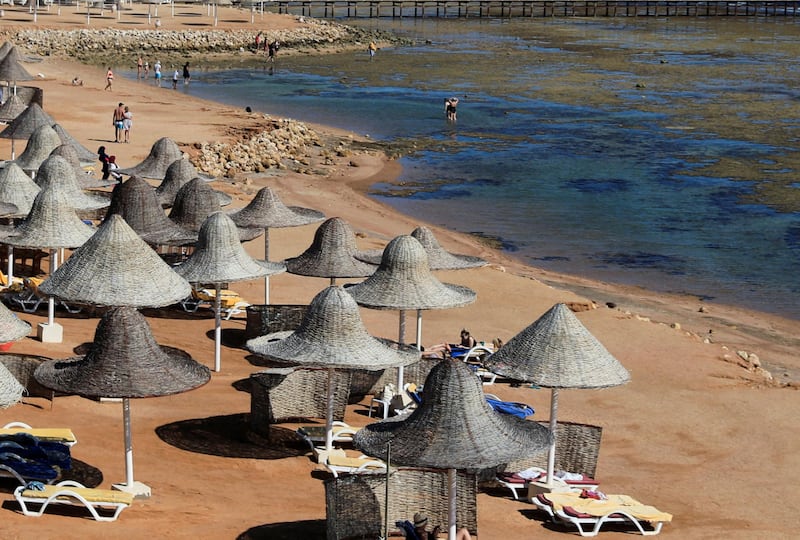 Tourists enjoy a day at the beach at low tide in the Red Sea resort of Sharm El-Sheikh, Egypt. Reuters