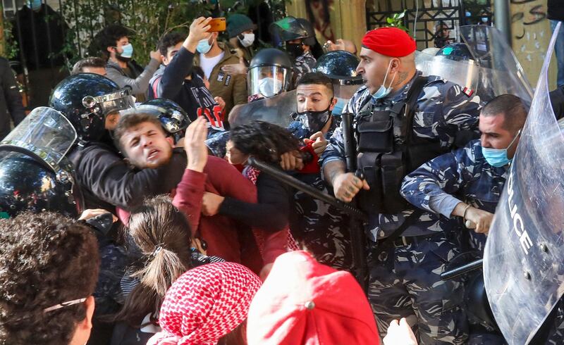 Police and protesters clash following a demonstration outside the entrance of the American University of Beirut, in the Lebanese capital's Bliss street. AFP
