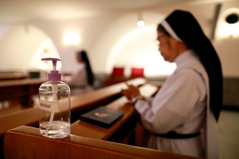 Hand sanitiser is placed on a pew inside the chapel where a mass is live-streamed on Facebook due to the coronavirus outbreak, in Manila Cathedral. Reuters