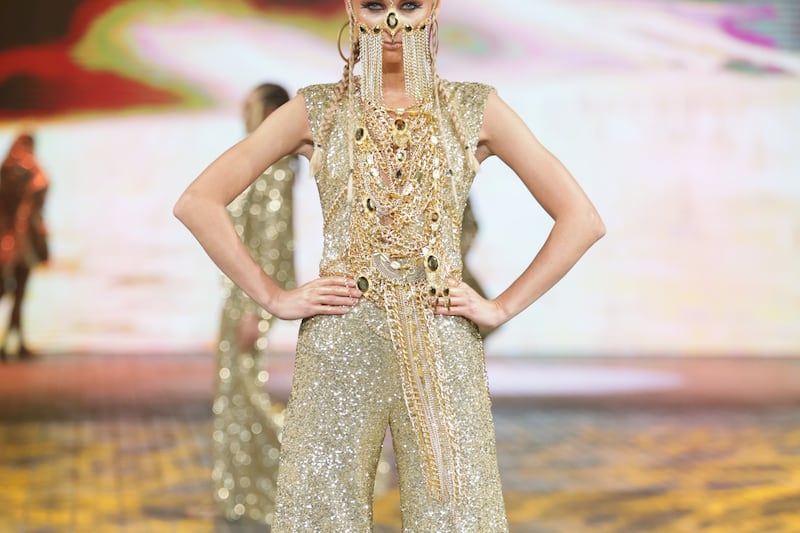A wide-legged jumpsuit featured oversized chains and jewels on the bodice.