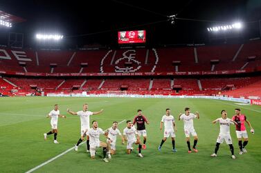 Soccer Football - La Liga Santander - Sevilla v Real Betis - Ramon Sanchez Pizjuan, Seville, Spain - June 11, 2020 Sevilla players celebrate after the match. Play resumed behind closed doors following the outbreak of the coronavirus disease (COVID-19) REUTERS/Marcelo Del Pozo