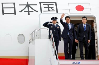 Japan's Prime Minister Shinzo Abe waves upon his departure for Tehran at Haneda airport in Tokyo. EPA