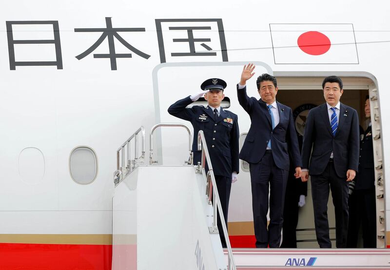 epa07642634 Japan's Prime Minister Shinzo Abe (C) waves upon his departure for Tehran at Haneda airport in Tokyo, Japan, 12 June 2019. It is the first visit by a Japanese prime minister to Iran in more than 40 years.  EPA/JIJI PRESS JAPAN OUT EDITORIAL USE ONLY/  NO ARCHIVES