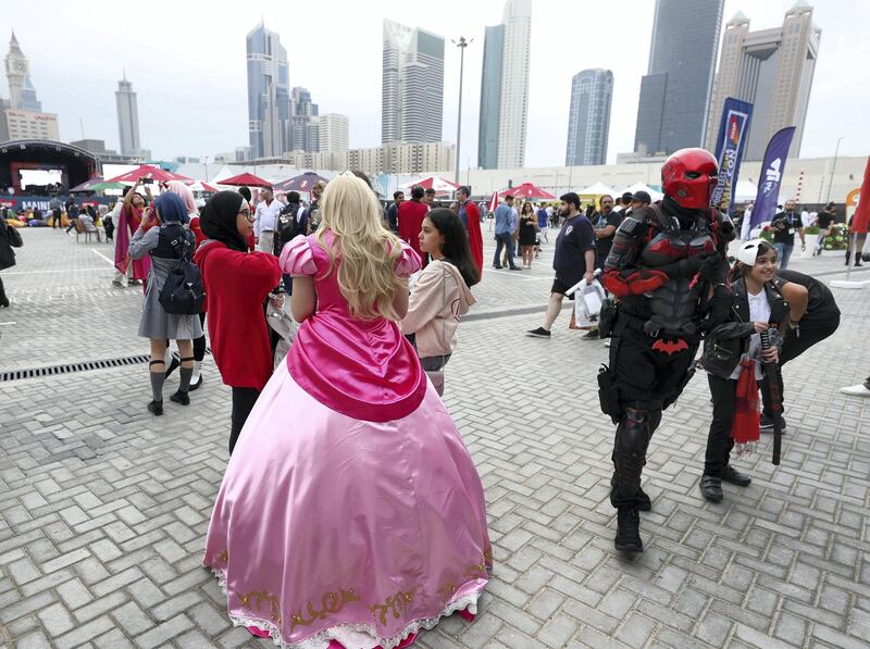 Dubai, United Arab Emirates - April 11, 2019: Visitors dress up as they visit the Middle East Film and Comic Con. Thursday the 11th of April 2019. World Trade Centre, Dubai. Chris Whiteoak / The National